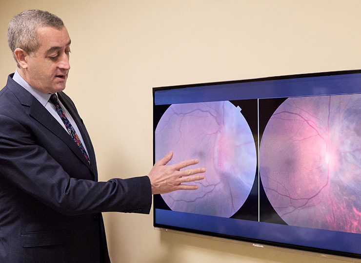 Photo of doctor examining ocular image